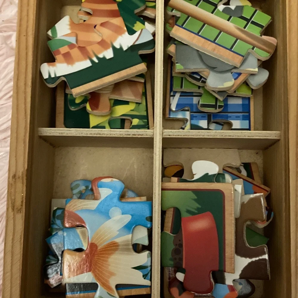 Children’s puzzles in wooden boxes
